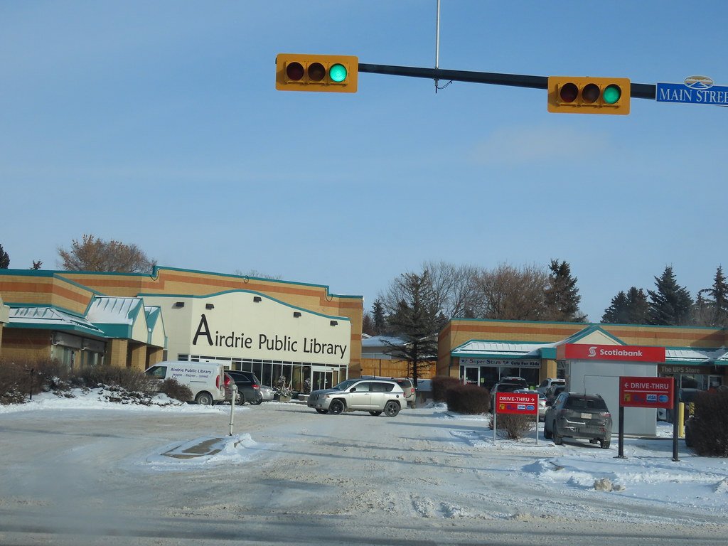 Airdrie town centre featuring the public library and local shops