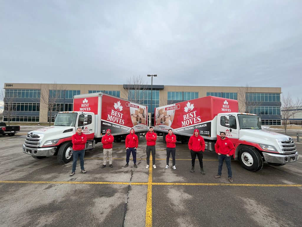 Best Moves team with two moving trucks ready for a Cochrane relocation